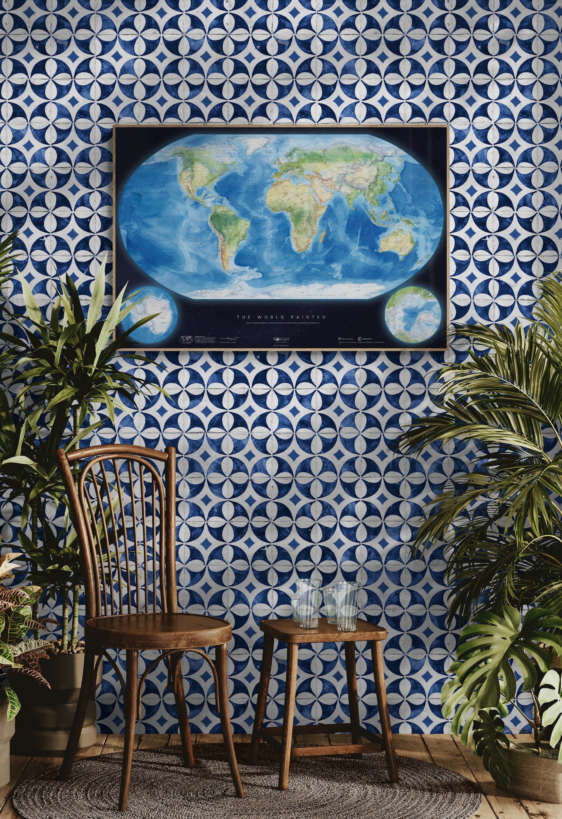 Room with blue and white patterned wallpaper, wooden chair, small table, and world map poster.